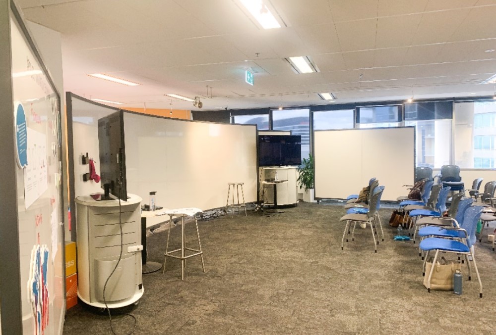 Capgemini Australia Graduate - Room with blue chairs and a white board