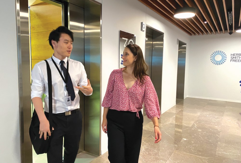 Male graduate bump into his colleague on the way to the office