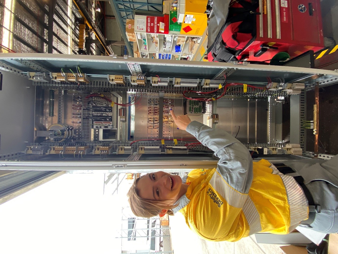 emily in front of the substation equiment